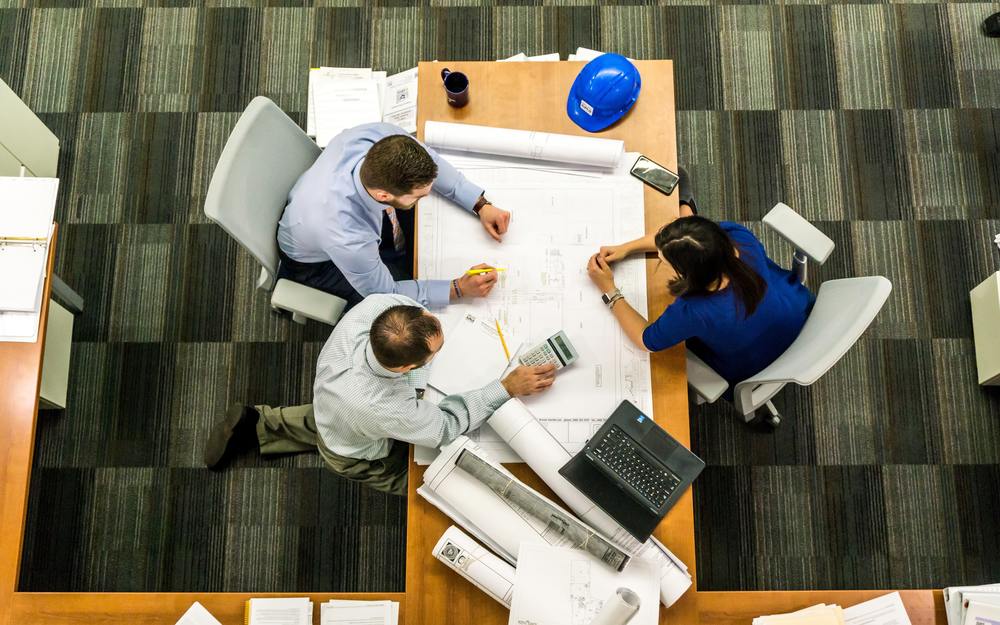 Construction professionals reviewing marketing plans for construction camera